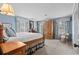 Spacious bedroom with natural light, classic furniture, and blue accents at 315 72Nd Ave. N # A, Myrtle Beach, SC 29572