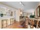 Open dining and kitchen area with hardwood floors, seating, and natural light at 315 72Nd Ave. N # A, Myrtle Beach, SC 29572