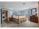 Serene bedroom with a four-poster bed, carpet and ample natural light at 315 72Nd Ave. N # A, Myrtle Beach, SC 29572