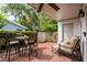 Relaxing patio with brick pavers, shade, and cozy seating at 315 72Nd Ave. N # A, Myrtle Beach, SC 29572
