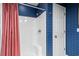 Walk-in shower with glass doors and red curtain and tiled walls at 315 72Nd Ave. N # A, Myrtle Beach, SC 29572