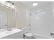 Bright and clean bathroom with white tile, a shower-tub combo, sink, and a vanity at 3269 Sims Rd., Marion, SC 29571