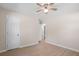 Bedroom with light wood floors, a ceiling fan, and a door that leads to another room at 3269 Sims Rd., Marion, SC 29571