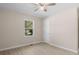 Bedroom featuring light wood floors, a ceiling fan, and a window overlooking a lawn at 3269 Sims Rd., Marion, SC 29571