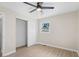 Bedroom with light wood floors, a window overlooking the yard, a sliding closet, and a ceiling fan at 3269 Sims Rd., Marion, SC 29571