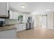 Beautiful updated kitchen featuring stainless appliances, granite counters and white cabinets at 3269 Sims Rd., Marion, SC 29571