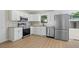 Beautiful updated kitchen featuring stainless appliances, granite counters and white cabinets at 3269 Sims Rd., Marion, SC 29571