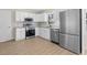 Well-lit kitchen featuring stainless steel appliances, white cabinets, modern countertops, and stylish backsplash at 3269 Sims Rd., Marion, SC 29571