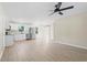 Open concept kitchen with stainless steel appliances, granite counters, and durable wood-look flooring at 3269 Sims Rd., Marion, SC 29571