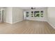Bright living room with multiple windows, new paint, and durable wood-look flooring at 3269 Sims Rd., Marion, SC 29571