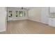 Bright living room with multiple windows, new paint, and durable wood-look flooring at 3269 Sims Rd., Marion, SC 29571