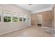 Bright living room featuring wood floors, brick accent wall, and lots of natural light at 3269 Sims Rd., Marion, SC 29571