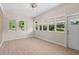 Bright living room with multiple windows, new paint, and durable wood-look flooring at 3269 Sims Rd., Marion, SC 29571