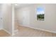 The living area features a bright window, luxury vinyl flooring and a new entrance at 3269 Sims Rd., Marion, SC 29571