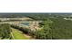 Aerial view of a planned community with pond views and tree-lined streets at 417 Spruce Pine Way, Conway, SC 29526