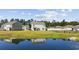 Water view homes with a pond that reflects the sky on a sunny day with blue skies at 417 Spruce Pine Way, Conway, SC 29526