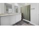 Bathroom features double sinks, a shower with curtain and white cabinets at 417 Spruce Pine Way, Conway, SC 29526