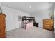 Bedroom with a bunk bed, dresser, and neutral colored carpet and paint at 417 Spruce Pine Way, Conway, SC 29526
