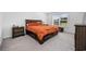 Comfortable bedroom showcases a wood frame bed, matching nightstands, and natural light from the window at 417 Spruce Pine Way, Conway, SC 29526