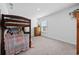 Bedroom with a bunk bed, dresser, and a bright window illuminating the space at 417 Spruce Pine Way, Conway, SC 29526