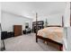 Bright bedroom showcasing a four-poster bed, workspace, and a view to the outside at 417 Spruce Pine Way, Conway, SC 29526