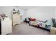 Comfortable bedroom featuring colorful accents, a cozy bed, and a dedicated study area at 417 Spruce Pine Way, Conway, SC 29526