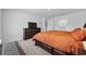 Spacious bedroom features a bed with storage drawers, a large dresser, and natural light at 417 Spruce Pine Way, Conway, SC 29526