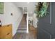Inviting foyer with hardwood floors, staircase, and view of the home's bright interior at 417 Spruce Pine Way, Conway, SC 29526