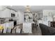 Bright, all-white eat-in kitchen with stainless steel appliances, modern bar stools, and pendant lighting at 417 Spruce Pine Way, Conway, SC 29526