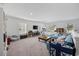 Spacious upstairs living room featuring a comfortable seating area, carpet flooring, and large windows at 417 Spruce Pine Way, Conway, SC 29526
