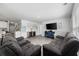 Spacious living room featuring neutral walls, recessed lighting, and contemporary wood-look floors at 417 Spruce Pine Way, Conway, SC 29526