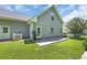 The backyard has a concrete patio, a manicured lawn, and a white picket fence at 4536 Fringetree Dr., Murrells Inlet, SC 29576