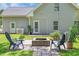 Relaxing backyard with a brick firepit and outdoor seating at 4536 Fringetree Dr., Murrells Inlet, SC 29576