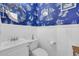 Nautical-themed half-bathroom with a unique round mirror and sailboat wallpaper at 4536 Fringetree Dr., Murrells Inlet, SC 29576