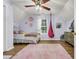 Bright bedroom with unique ceiling fan and decorative wall accents at 4536 Fringetree Dr., Murrells Inlet, SC 29576