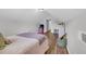 Attic bedroom features wood-look floors, neutral walls, and charming decor at 4536 Fringetree Dr., Murrells Inlet, SC 29576