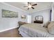 Comfortable bedroom with hardwood floors, a ceiling fan, and a cozy armchair at 4536 Fringetree Dr., Murrells Inlet, SC 29576