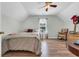 Charming bedroom featuring wood floors, neutral walls, and ceiling fan at 4536 Fringetree Dr., Murrells Inlet, SC 29576