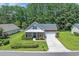 Charming brick home featuring a landscaped front yard, a covered porch, and a two-car garage at 4536 Fringetree Dr., Murrells Inlet, SC 29576