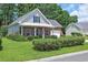 Attractive single Gathering home with brick accents, manicured landscaping, and a welcoming front porch at 4536 Fringetree Dr., Murrells Inlet, SC 29576