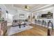 Inviting living room featuring hardwood floors, a ceiling fan, and an open view to the kitchen at 4536 Fringetree Dr., Murrells Inlet, SC 29576