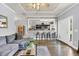 Bright living area featuring hardwood floors, an open layout, and a seamless connection to the kitchen at 4536 Fringetree Dr., Murrells Inlet, SC 29576