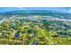 Aerial view of a golf course with ponds, bridges, and various residential neighborhoods at 4650 Greenbriar Dr. # A5, Little River, SC 29566