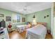 Bright bedroom with two twin beds, ceiling fan and window view at 4650 Greenbriar Dr. # A5, Little River, SC 29566
