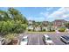 View of community pool and surrounding buildings featuring parking and lush greenery at 4650 Greenbriar Dr. # A5, Little River, SC 29566