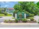 Welcome sign to Spinnaker Bay at Eastport surrounded by lush green landscaping at 4650 Greenbriar Dr. # A5, Little River, SC 29566