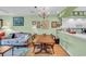 Inviting dining room with a chandelier, hardwood floors, and seamless access to the open kitchen at 4650 Greenbriar Dr. # A5, Little River, SC 29566