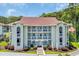 Attractive condo building with multiple balconies and manicured landscaping offering a relaxing outdoor space at 4650 Greenbriar Dr. # A5, Little River, SC 29566