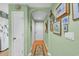 Hallway with wooden floor featuring an archway and decorated walls, plus access to rooms with white doors at 4650 Greenbriar Dr. # A5, Little River, SC 29566