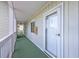 Exterior hallway showcasing unit door and outdoor view at 4650 Greenbriar Dr. # A5, Little River, SC 29566